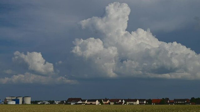 Time lapse, a thundercloud forms over a residential area, Plattling, Lower Bavaria, Germany