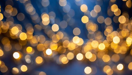 Fototapeta premium Warm Festive Golden Bokeh Lights on Dark Blue Background