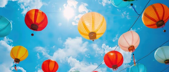 Colorful lanterns in a blue sky, perfect for event promotions