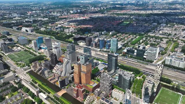 Aerial of Amsterdam with the financial business center known as the South Axis - Zuid As by helicopter