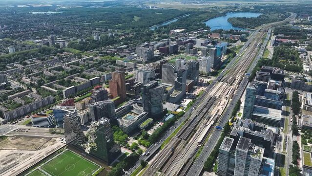 Aerial of Amsterdam with the financial business center known as the South Axis - Zuid As by helicopter