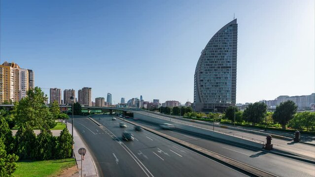 Day time lapse from central Baku in Azerbaijan with traffic passing a modern hotel