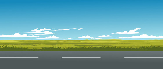 Grassland on sunny day with empty road