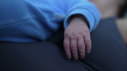 Close-up of a newborn baby's tiny hand, highlighting the delicate and intricate details, emphasizing the beauty and fragility of new life in a tender and heartwarming moment