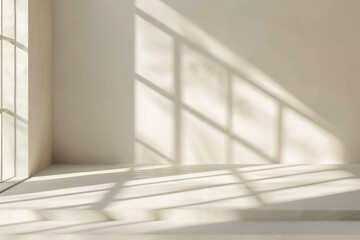 Fototapeta premium A beige studio background is set for product presentations, featuring shadows from a window and sunlight casting across an empty room with white walls and floors