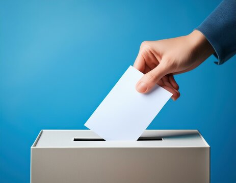 hand is putting a letter into the ballot box. election concept