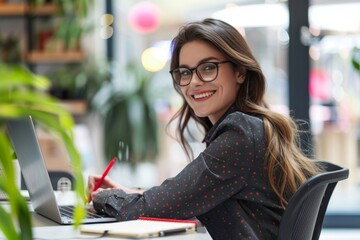 Young woman using laptop computer to search for information in the college library during online language classes
