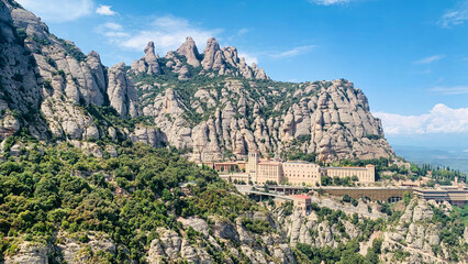 A mountain range with a small town in the valley