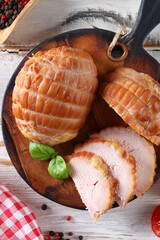 deli meats sausage on a wooden board for appetizer