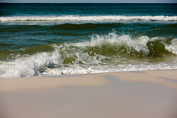 Waves from the Gulf of Mexico break onshore at Topsail Hill Preserve, Santa Rosa Beach, Florida