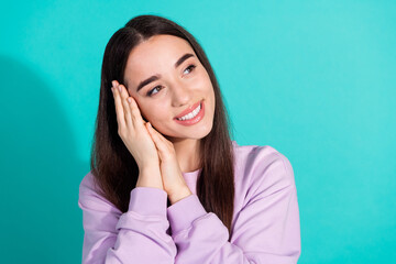 Photo portrait of attractive young woman look dreamy empty space dressed stylish violet clothes isolated on aquamarine color background