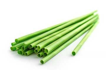 A collection of green straws arranged on a clean white surface