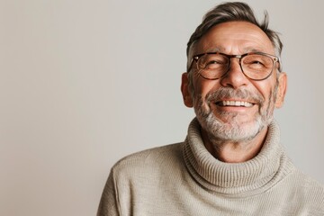 Obraz premium Portrait of a blissful man in his 50s wearing a classic turtleneck sweater isolated in white background