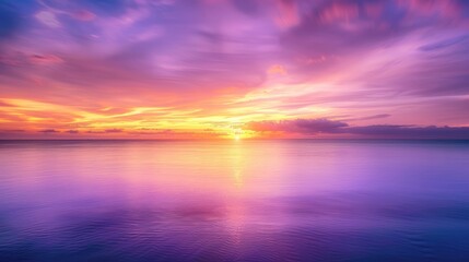 Obraz premium A serene seascape under a lively sunset sky: surreal hues of purple, orange, and yellow create a mesmerizing panorama.
