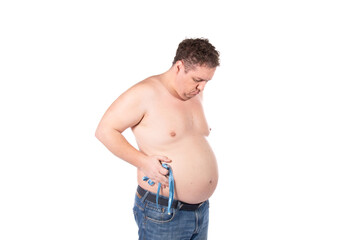 Fototapeta premium Funny fat man on a diet. Guy posing on a white background.
