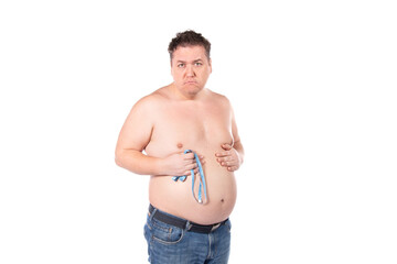 Fototapeta premium Funny fat man on a diet. Guy posing on a white background.
