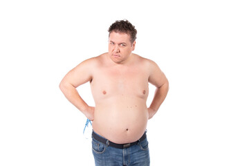 Fototapeta premium Funny fat man on a diet. Guy posing on a white background.
