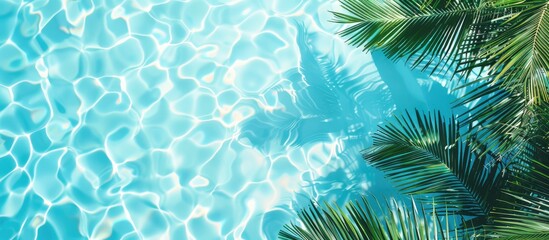 Pool edge and water with exotic summer vibes. Minimal vacation idea captured in a flat lay, top view composition with space for text.