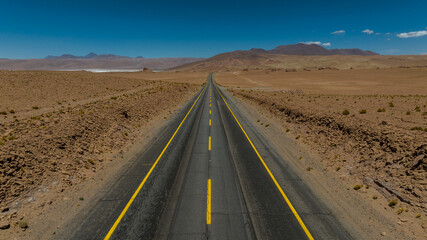 Atacama Desert in Chile. Aerial view. Route 27, road during a car trip. Salar de Loyoques.