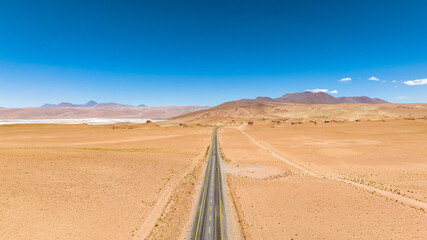 Atacama Desert in Chile. Aerial view. Route 27, road during a car trip. Salar de Loyoques.