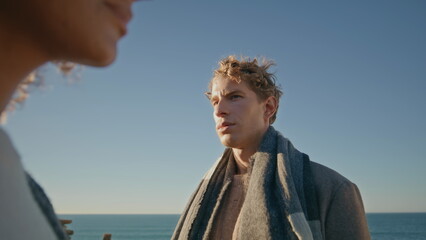 Fototapeta premium Frustrated man contemplating breakup at coast closeup. Couple feeling offended