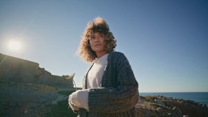 Fototapeta premium Romantic model resting marine landscape at windy weather zoom on. Dreamy girl