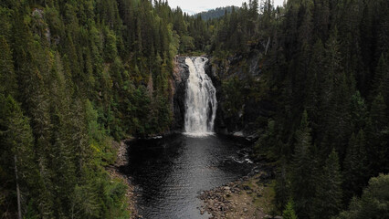 Autumnal landscape of Homla river near Hommelvik, middle Norway. Area of Storfossen waterfall. Bird point of view - Aerial Shot