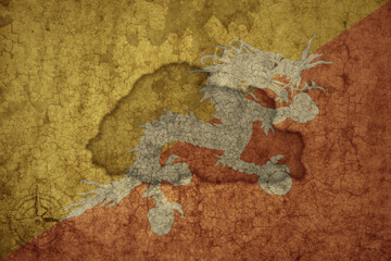 map and flag of bhutan on a old vintage crack paper background .