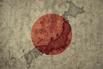 map and flag of japan on a old vintage crack paper background .