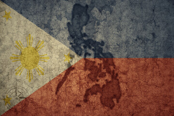 map and flag of philippines on a old vintage crack paper background .