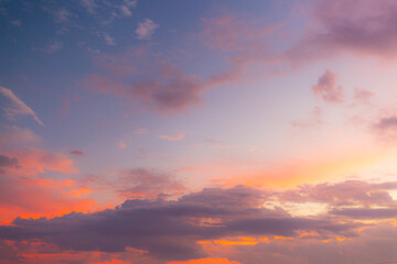 Clouds and sky in the evening,Real majestic sunrise sundown sky background with gentle colorful clouds without birds. Panoramic, big size