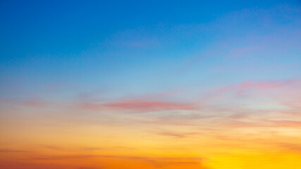 Clouds and sky in the evening,Real majestic sunrise sundown sky background with gentle colorful clouds without birds. Panoramic, big size