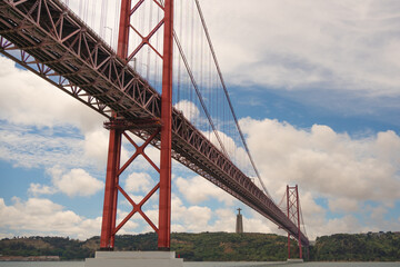 25 April Bridge over the Tagus River in Lisbon on a clouds day