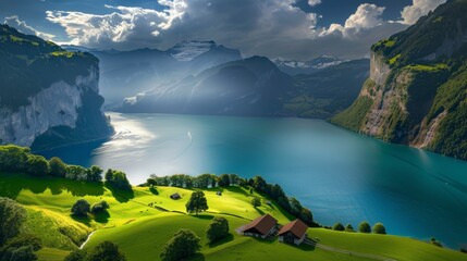 Picturesque town by a tranquil lake surrounded by green hills, under a clear blue sky.