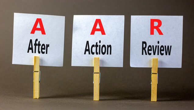 AAR After action review symbol. Concept words AAR After action review on beautiful white paper. Beautiful grey background. Business AAR after action review concept. Copy space.