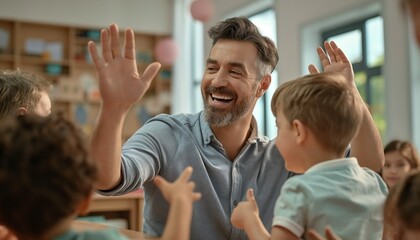 A smiling man high-fives children around him in a classroom setting, representing an atmosphere of encouragement, positive reinforcement, and joyful learning and interaction.