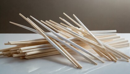モダンなテーブルに散らばる割り箸、高級感のある白い背景、ちょっとお洒落でシンプルに仕上げる、イラスト風 Generated by AI
