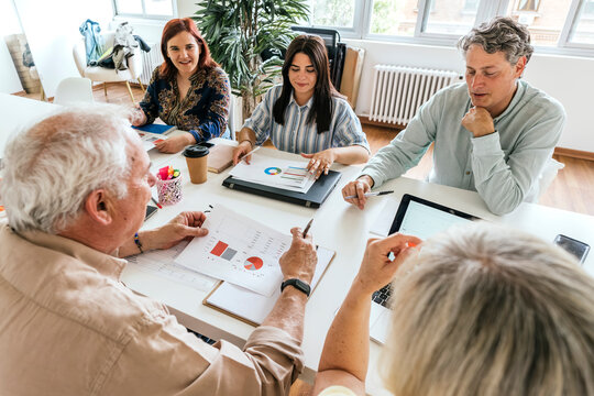 Diverse group of professionals collaborating in a meeting