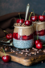 Black forest chia puddings topped with fresh cherries and cacao nibs.