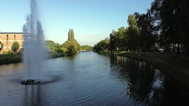 Flight over a calm Werre river in Herford, Germany.