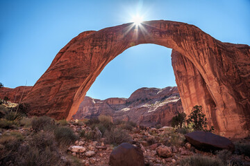Sun Crests over the Rainbow Bridge, Rainbow Bridge National Monument, Lake Powell, Utah