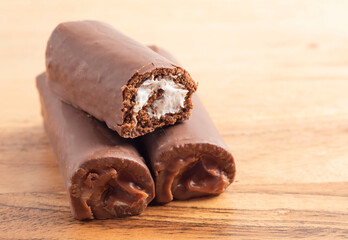 Chocolate Swiss Cake Roll on a Wood Table