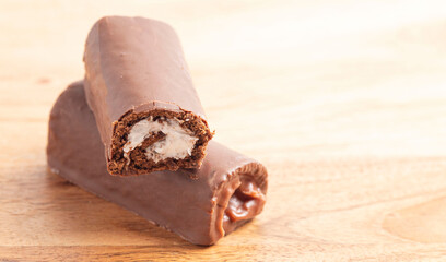 Chocolate Swiss Cake Roll on a Wood Table