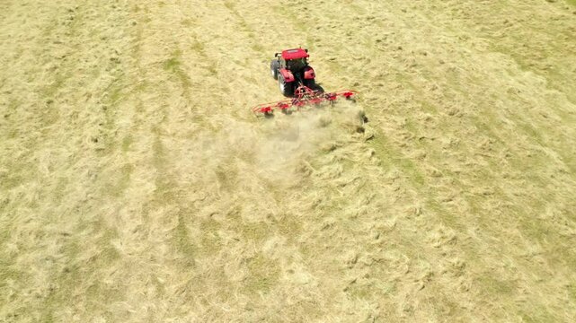 Harvest of hay field on small farm. Industrial background. Agricultural production from above. Agriculture and environment in European Union. 
