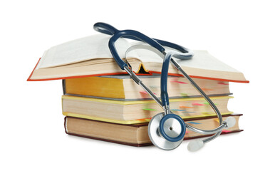 Stethoscope on stack of books against white background