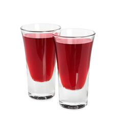 Shot glasses of delicious cherry liqueur isolated on white