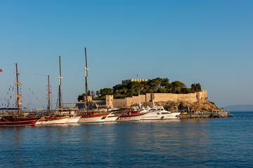 Naklejka premium Guvercinada Island (Pigeon Island) and Guvercinada Castle in Kusadasi. Aydin, Turkey. Kusadasi is a popular tourist destination in Turkey.