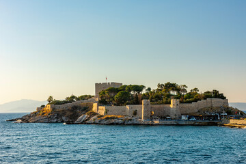 Guvercinada Island (Pigeon Island) and Guvercinada Castle in Kusadasi. Aydin, Turkey. Kusadasi is a popular tourist destination in Turkey.
