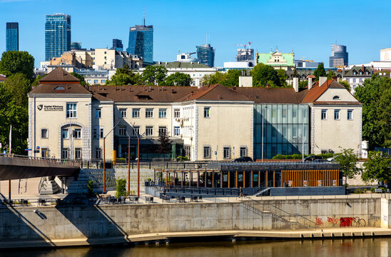 Wybrzeze Kosciuszkowskie street onshore Vistula river embankment with downtown skyscrapers of Warsaw in Poland