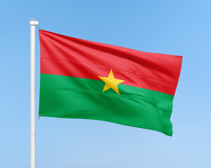 Fototapeta premium Burkina Faso flag on stick on sky background. Realistic flag illustration